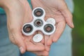 Broken details of a white spinner in the hands