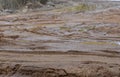 Broken dirt road after heavy rain. Swampy lagoon of a road demonstrates the most common problem in maintaining rural roads Royalty Free Stock Photo