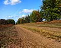 A broken dirt road stretching into the distance leads into the unknown Royalty Free Stock Photo