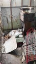a broken dish rack in a dirty, unkempt warehouse