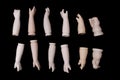 Broken Doll Body Parts Hands and Arms on Black Background Royalty Free Stock Photo