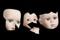 Broken Doll Face and Head on Black Background Royalty Free Stock Photo