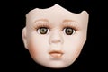 Broken Doll Face and Head on Black Background Royalty Free Stock Photo