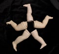 Broken Doll Parts on Black Background Royalty Free Stock Photo