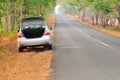 Broken-down car on an asphalt road Royalty Free Stock Photo