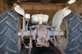 Broken down old tractor in barn Royalty Free Stock Photo