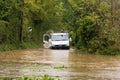 Broken down vehicle in a flooded country lane during Storm Alex. UK