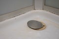 Broken drain cover in the shower cabin