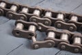 Broken driving roller chain. Parts of destroyed industrial chain