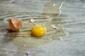 Broken egg on the floor with copy space Selective focus. This photo can be used for the concept of how to clean up the dropped