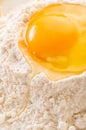 broken egg in flour close-up Royalty Free Stock Photo