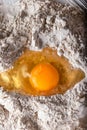 Broken egg on flour on marble background Royalty Free Stock Photo