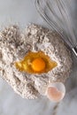 Broken egg on flour on marble background Royalty Free Stock Photo