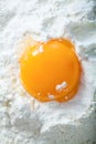 Broken egg on flour Royalty Free Stock Photo