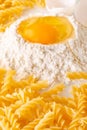 broken egg in flour and pasta Royalty Free Stock Photo