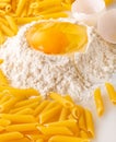 broken egg in flour and pasta