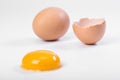 Broken egg isolated on white background. Raw egg yolk Royalty Free Stock Photo