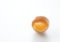 A broken egg placed on a white background with copy space Royalty Free Stock Photo
