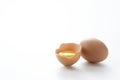 A broken egg placed on a white background with copy space Royalty Free Stock Photo