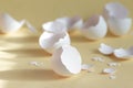 Broken egg shell on yellow background with space for text Royalty Free Stock Photo