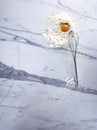 Broken eggs and hand mixer on marble background Royalty Free Stock Photo