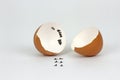 Broken Eggs shell with footprints on white Background Royalty Free Stock Photo