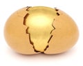 Broken eggshell with golden egg inside Royalty Free Stock Photo