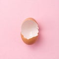 Broken Eggshell on Pink Background Royalty Free Stock Photo