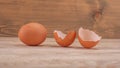Broken eggshell on rustic wooden table Royalty Free Stock Photo