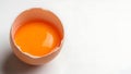 Broken eggshell with yolk on white background Royalty Free Stock Photo