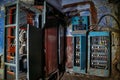 Broken electrical switchgear cabinets with control panels in abandoned building Royalty Free Stock Photo