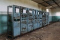 Broken electrical switchgear cabinets with control panels in abandoned factory Royalty Free Stock Photo