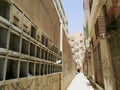 Broken, empty mailboxes in a passage with graffiti walls, Saudi Arabia