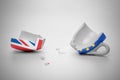 broken European Union and United Kingdom flags cup with few little pieces, concept brexit