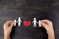 Broken family concept, divorce. Child hands with broken paper cut fmily Royalty Free Stock Photo