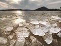 Broken floes and iceberg. A large ice piece on freshwater ice that has broken off