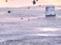 Broken floes and iceberg. A large ice piece on freshwater ice that has broken off