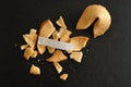 A broken fortune cookie with a piece of paper Royalty Free Stock Photo