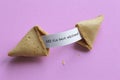 Broken fortune cookie showing a message Royalty Free Stock Photo