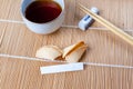 Broken Fortune Cookie with Slip and Chopsticks and Tea