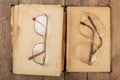 Broken frame from glasses. Old book and glasses Royalty Free Stock Photo