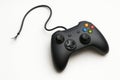 A broken gamepad with a broken wire on a white background. Space for text. Royalty Free Stock Photo
