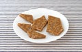 Broken ginger brittle on a plate Royalty Free Stock Photo