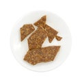 Broken ginger brittle on a plate top view Royalty Free Stock Photo