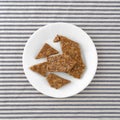 Broken ginger brittle on a plate Royalty Free Stock Photo