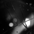 Black minimalist background with cracks on the glass with water droplets. Royalty Free Stock Photo