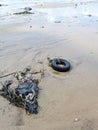 Tyre Pollution on Mumbai Versova beach endangering marine life Royalty Free Stock Photo