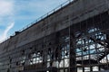 Broken glass and destroyed facade of industrial building