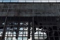 Broken glass and destroyed facade of an industrial workshop