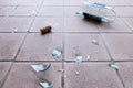 Broken glass on the floor, alcohol abuse